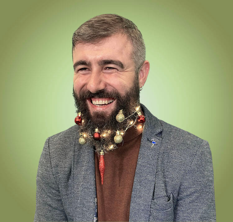 man with christmas beard laughing